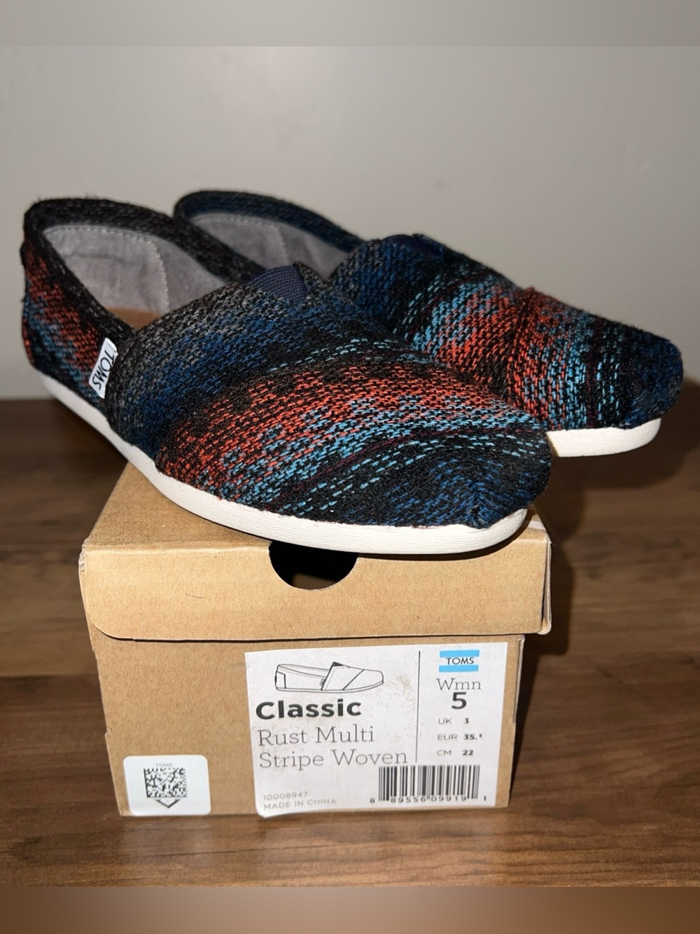 Toms women’s Rust Multi Stripe Woven Classic Slip-Ons